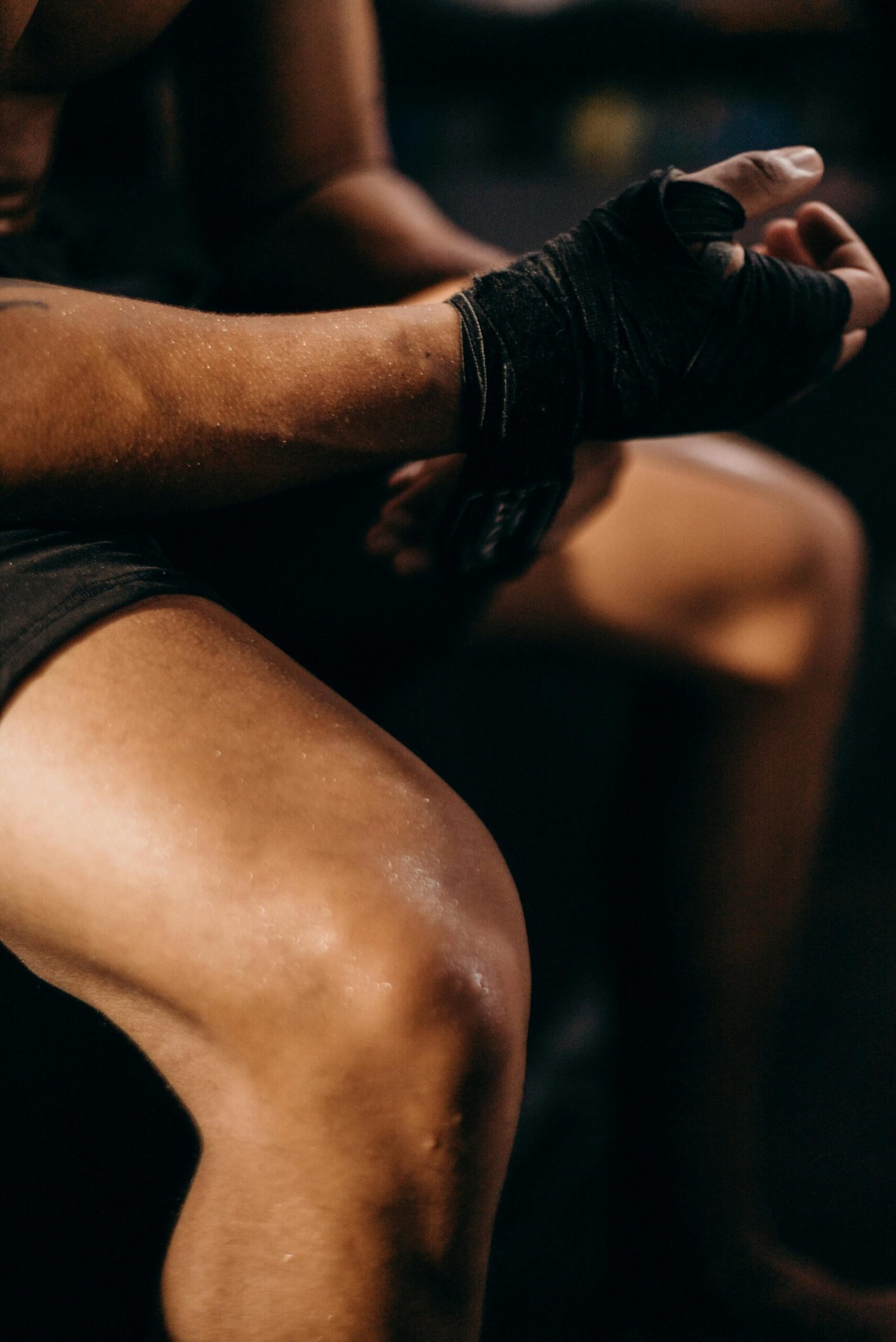 A focused shot of a boxer's hand wrap preparation, conveying strength and discipline.